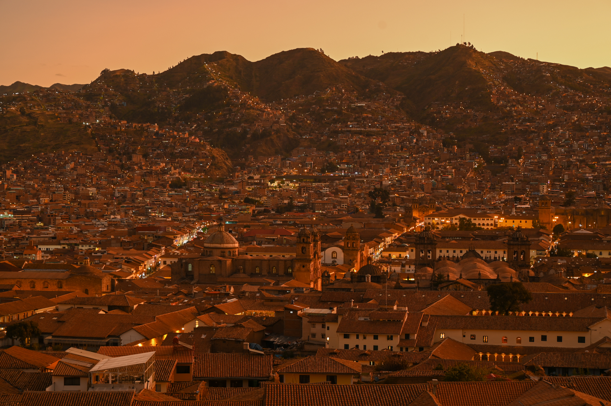 City lights of Cusco, Peru at sunset, the perfect home base for a 10 day Peru itinerary